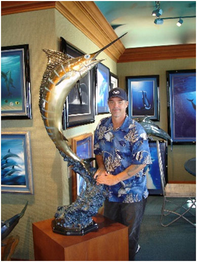 Wyland with a large bronze sculpture