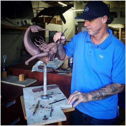 bronze-sculptures-by-Wyland Wyland working on bronze sculpture.