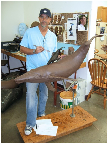 Wyland working on bronze sculpture for a table